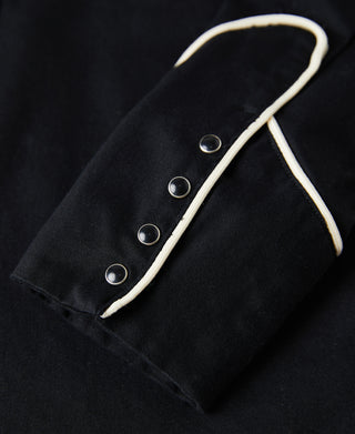 Black western shirt sleeve with contrast white snap placket and silver snap buttons