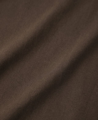 Coffee-brown cotton jersey fabric close-up with fine weave texture