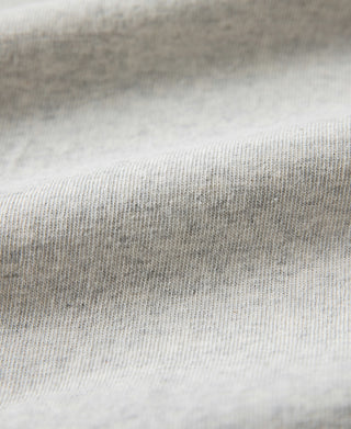 Oatmeal cotton T-shirt fabric knit texture close-up.