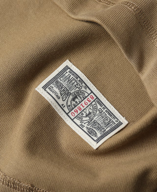 Khaki henley with inside neck label tag and visible fabric texture