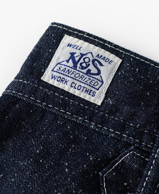 Indigo denim carpenter pants fabric label on front pocket flap