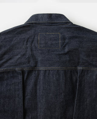 Indigo denim jacket back with rectangular patch and yoke stitching