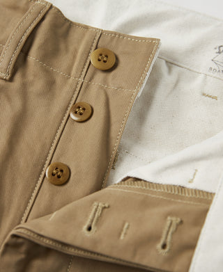 Khaki trousers front with three-button closure and waistband tabs