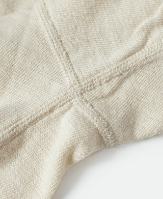 Cream knit henley T-shirt with short sleeves and buttoned placket