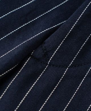 Navy fabric with white pinstripes and fine woven texture