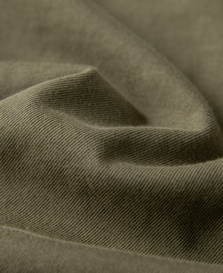Olive short-sleeve henley T-shirt fabric close-up
