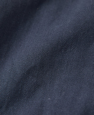 Navy utility shorts fabric close-up with subtle texture