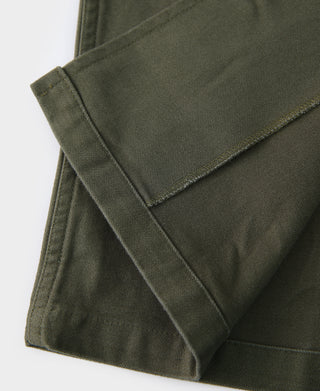 Olive fatigue utility shirt folded hem and inner pocket edge detail