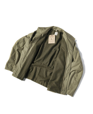 Olive green field jacket, button front and pointed collar, flat lay