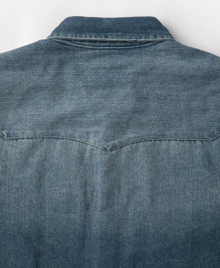 Blue slub denim western shirt back yoke with center seam detail.