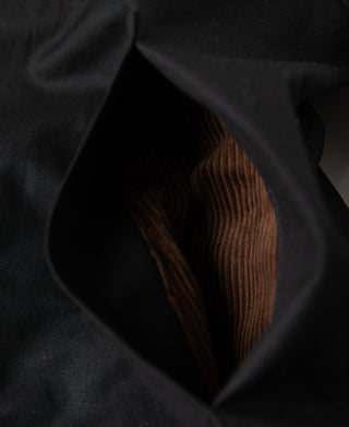 Black jacket lining with brown ribbed corduroy inner panel