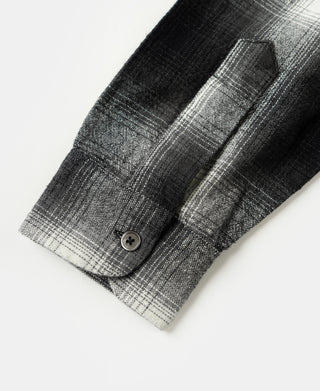 Black-and-white ombre check brushed cotton sports shirt sleeve cuff with button.