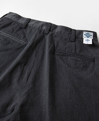 Dark gray pleated chino trousers with belt loops and front pleats