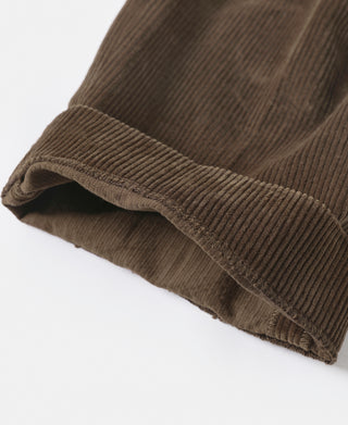 Brown corduroy trouser leg hem with ribbed cuff and fold