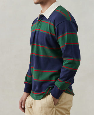 Mens rugby shirt side view, navy with green and red stripes and white collar detail
