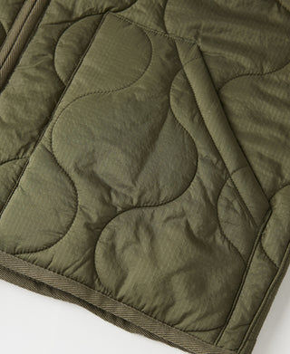 Olive quilted padded nylon jacket fabric with arched quilting lines and stitched seams