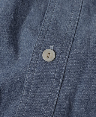 Blue chambray work shirt front button closure with vertical stitching