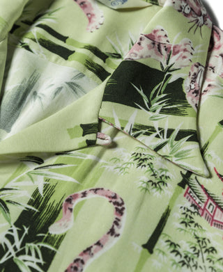 Light green fabric closeup with tiger and bamboo pattern for aloha shirt