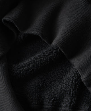 Black raglan sweatshirt with soft fleece lining and textured interior seam