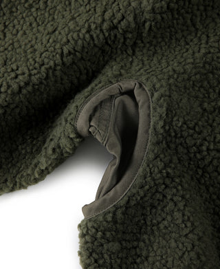 Olive sherpa-lined collar with curved seam and stitched edge