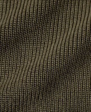 Olive wool sweater knit closeup with tight ribbed pattern