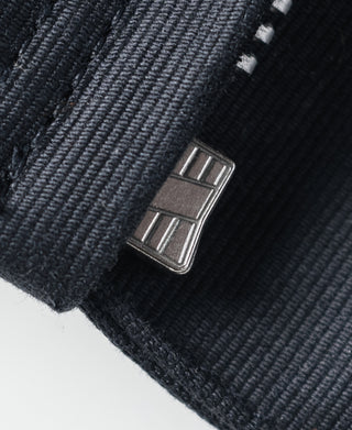 Navy deck jacket metal snap with ribbed fabric cuff close-up
