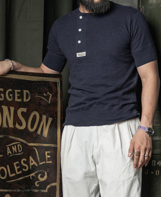 Navy henley T-shirt with three-button placket, model wearing