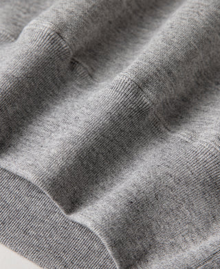 Gray heavyweight ski sweater knit with ribbed cuffs and neckline trim