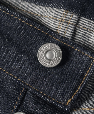 Indigo denim coin pocket button with engraved metal design