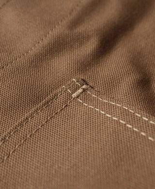 Khaki canvas hunting vest interior seam and reinforced stitching