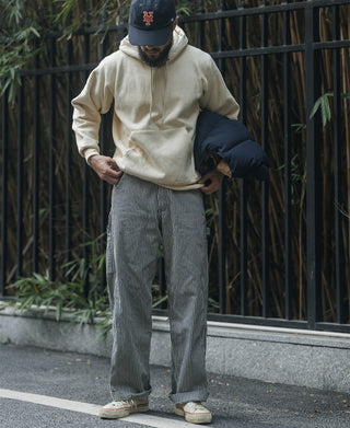 Apricot pullover hoodie with kangaroo pocket and ribbed hem.