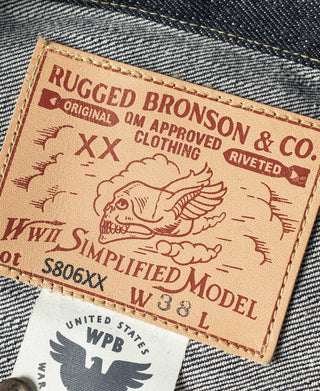 Indigo denim jacket woven patch label with brown background and printed text