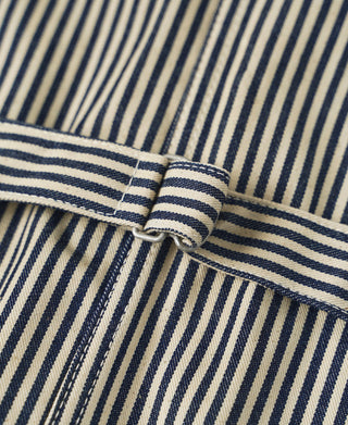 Striped vest hem with attached belt strap and stitched fold