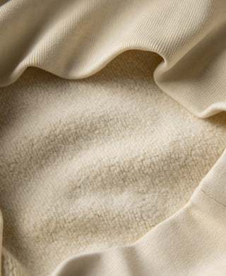 Cream sweatshirt fabric with ribbed hem and side panel seam