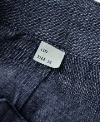 Indigo chambray pants waistband label, size M