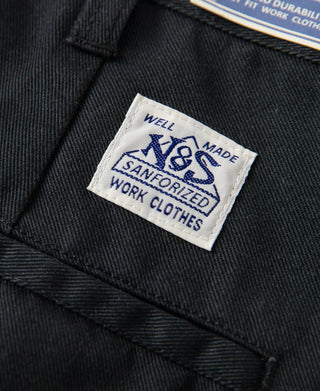 Black work pants with interior label and sewn belt loop