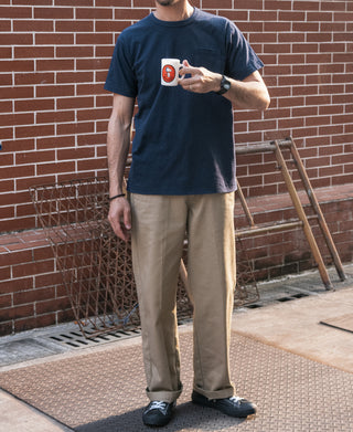 Indigo pocket T-shirt worn by model with beige pants