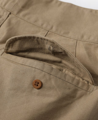 Khaki bermuda shorts with cargo-style side pocket and button closure