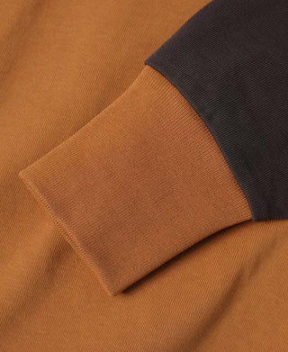 Orange long-sleeve T-shirt with dark cuff detail