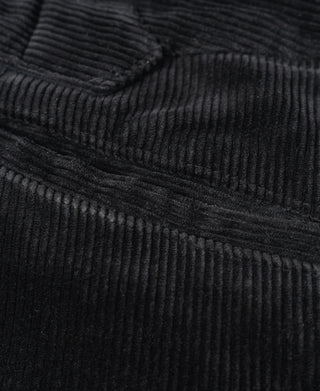 Black corduroy work pants seam and waistband edge detail