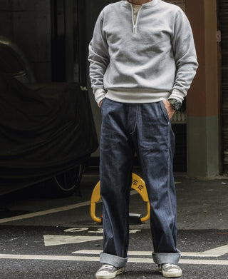 Gray half-zip fleece sweatshirt with ribbed cuffs and waistband