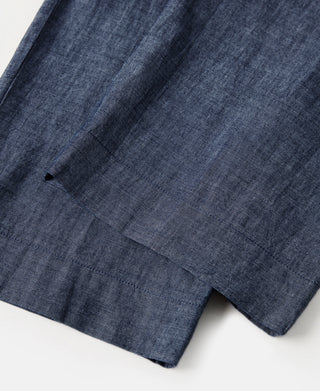 Indigo chambray pants front with pleats and center seam detail