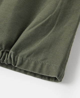 Olive jacket sleeve hem with elastic cuff and stitched edge