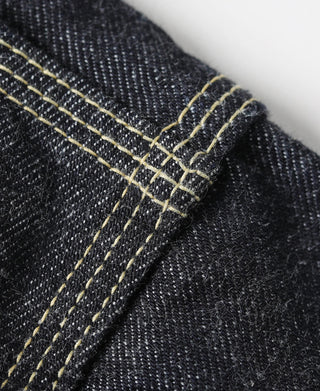 Indigo denim jacket cuff detail with double row of yellow topstitching