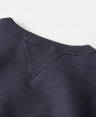 Navy knit sweater neckline with V-stitch seam and ribbed collar