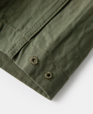 Olive fatigue trousers, cargo pocket flap with two button closures