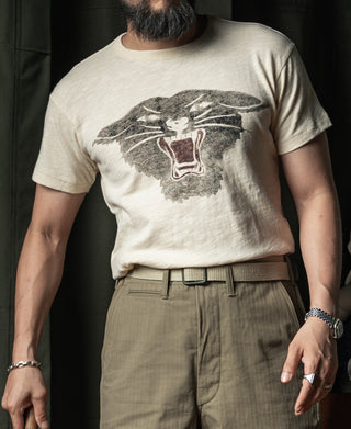 Cream CCC t-shirt with black panther head graphic on the front