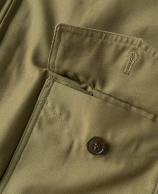 Khaki flight jacket front pocket with button closure and stitched flap