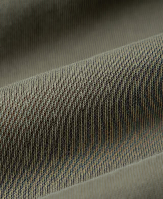 Light olive fabric texture with ribbed trim on cuff