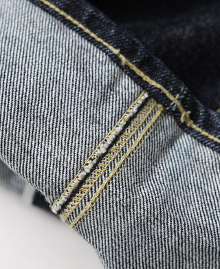 Indigo selvedge denim jeans showing belt loop with double yellow edge stitch
